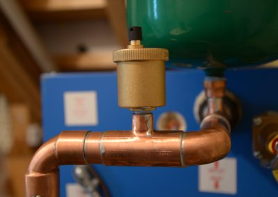Copper piping and air vent on a boiler
