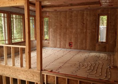 In-floor heating loops in a framed room